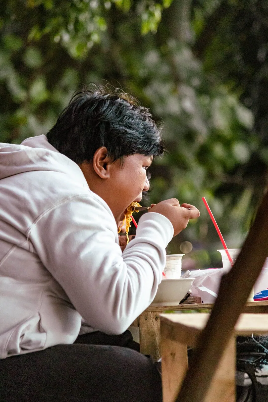 Traveler eating confidently at a restaurant abroad, relaxed and at ease