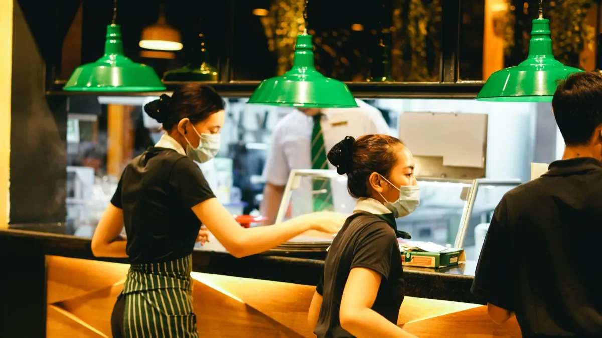 Restaurant servers discussing an order