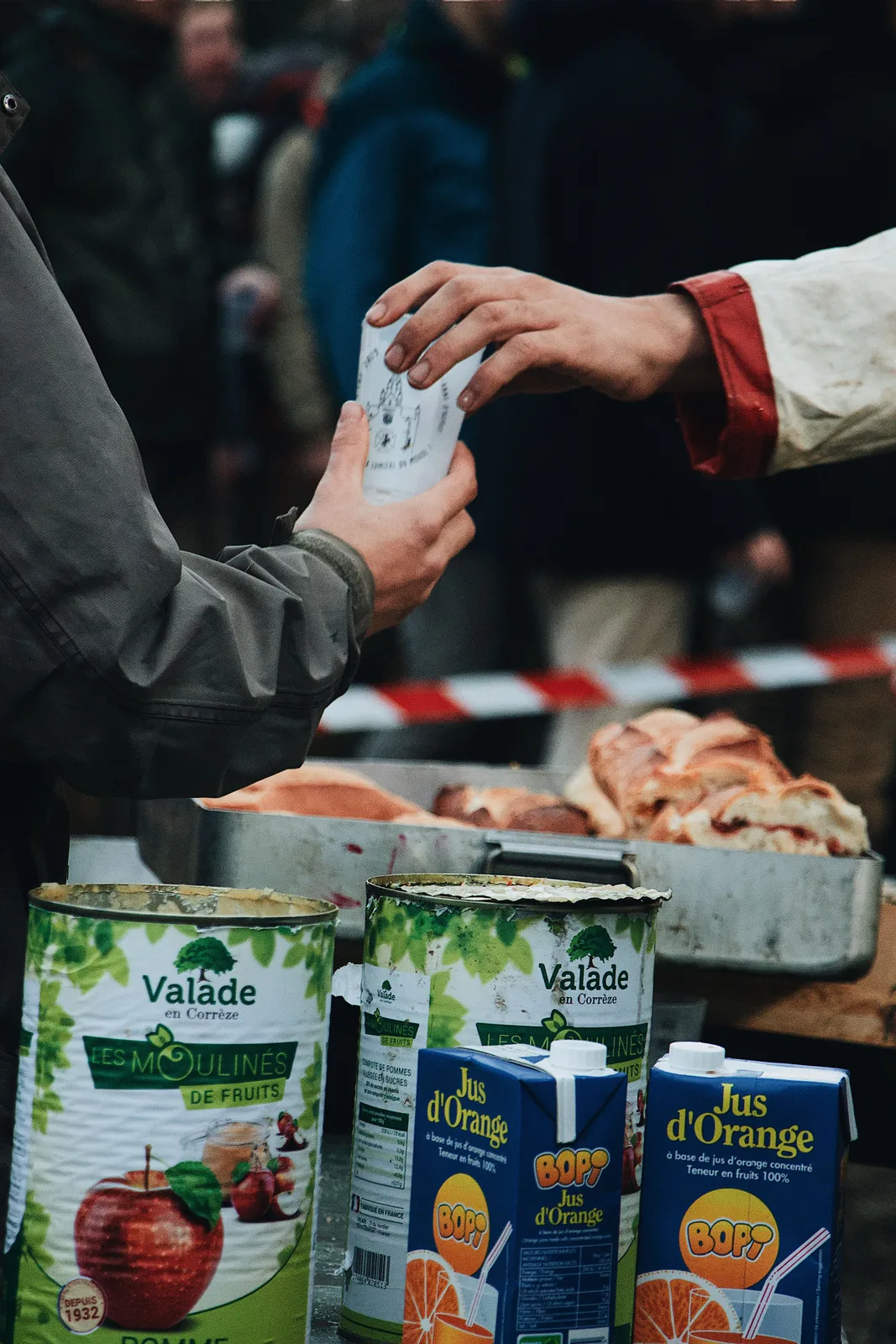 Customer paying at a market food stall