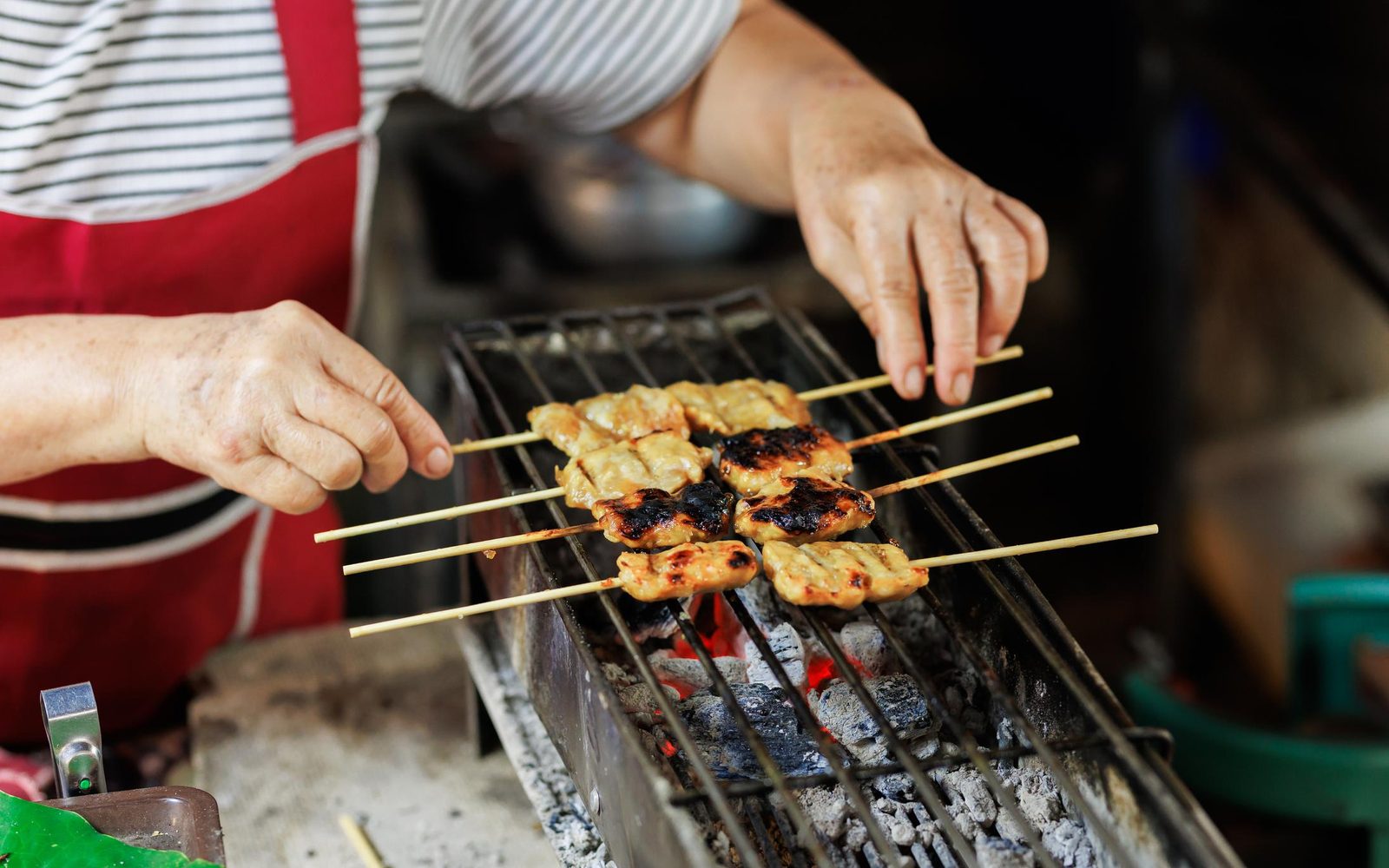 Thai street food vendor preparing dishes