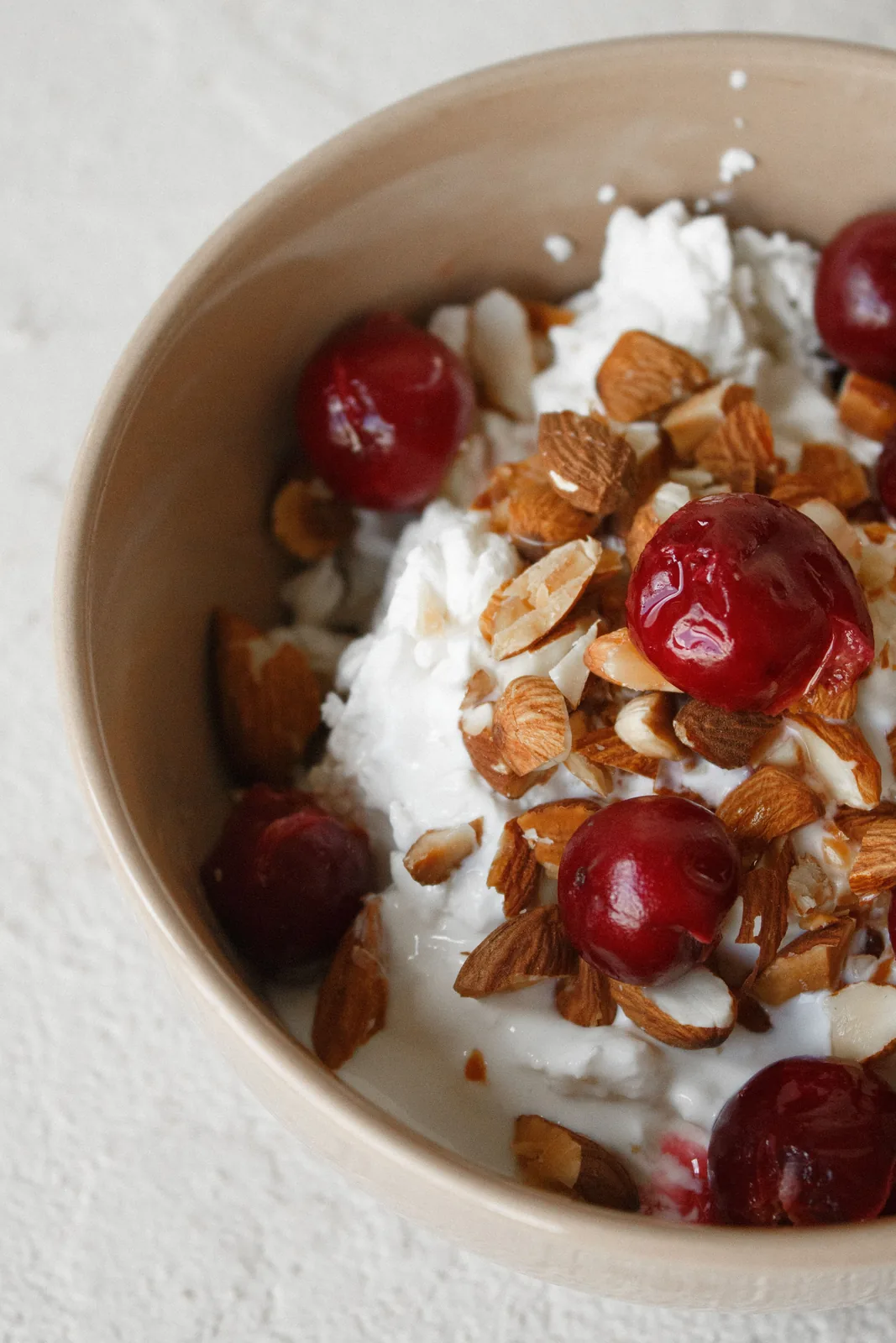 Yogurt bowl with cherries, nuts, and raisins