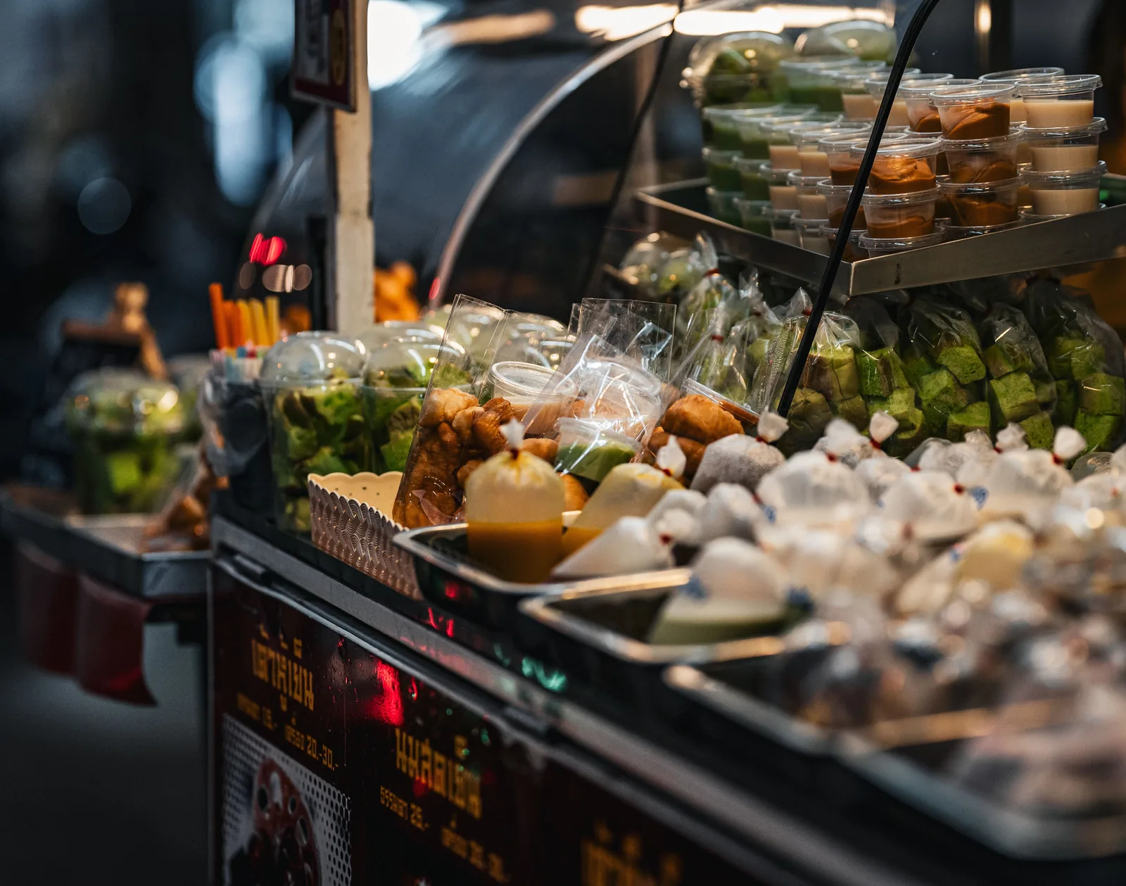 Asian market stall with fruit and handwritten signage