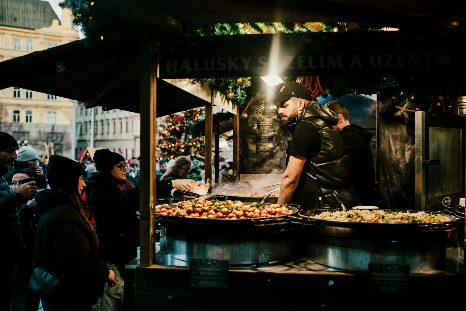 Night market vendor cooking at a food stall