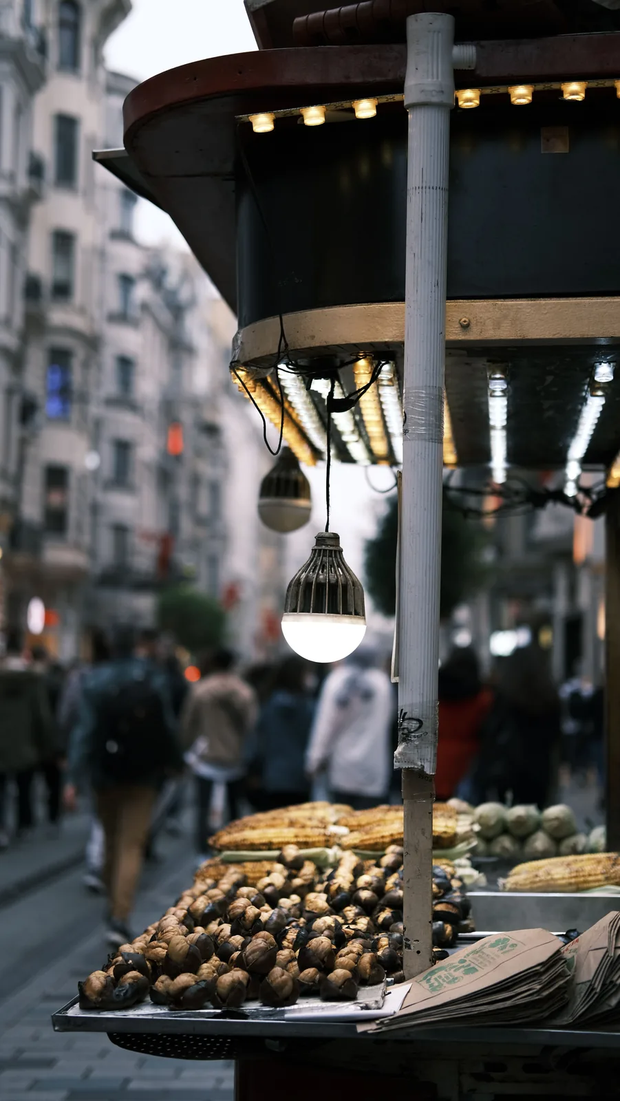 Roasted chestnut cart in a European alley at night
