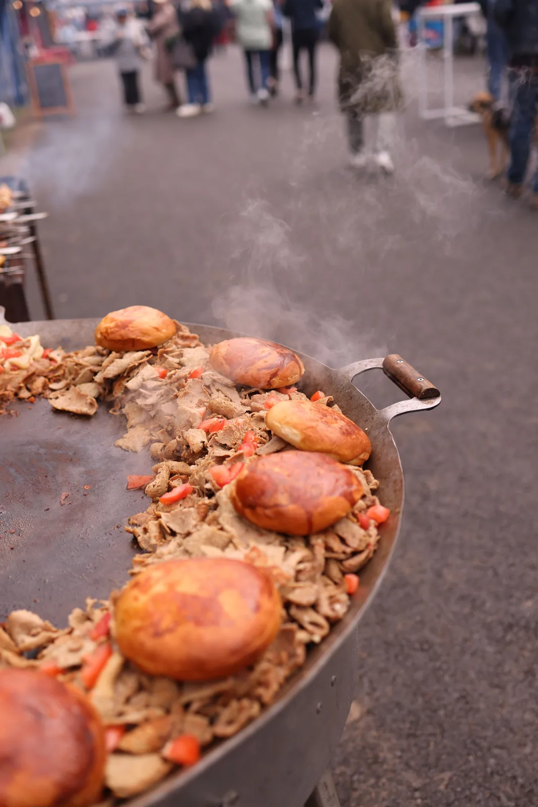 Street food grilling over steam