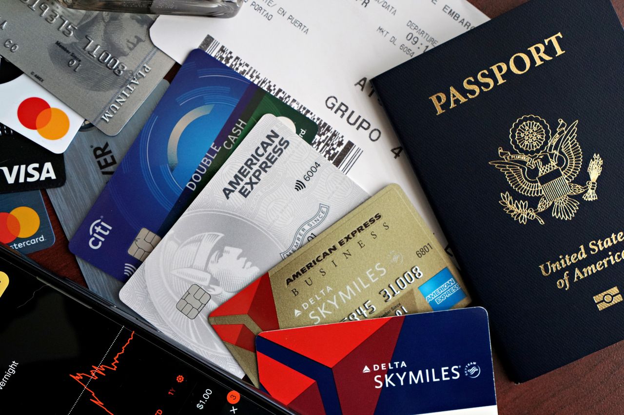 Travel documents and insurance paperwork on a desk