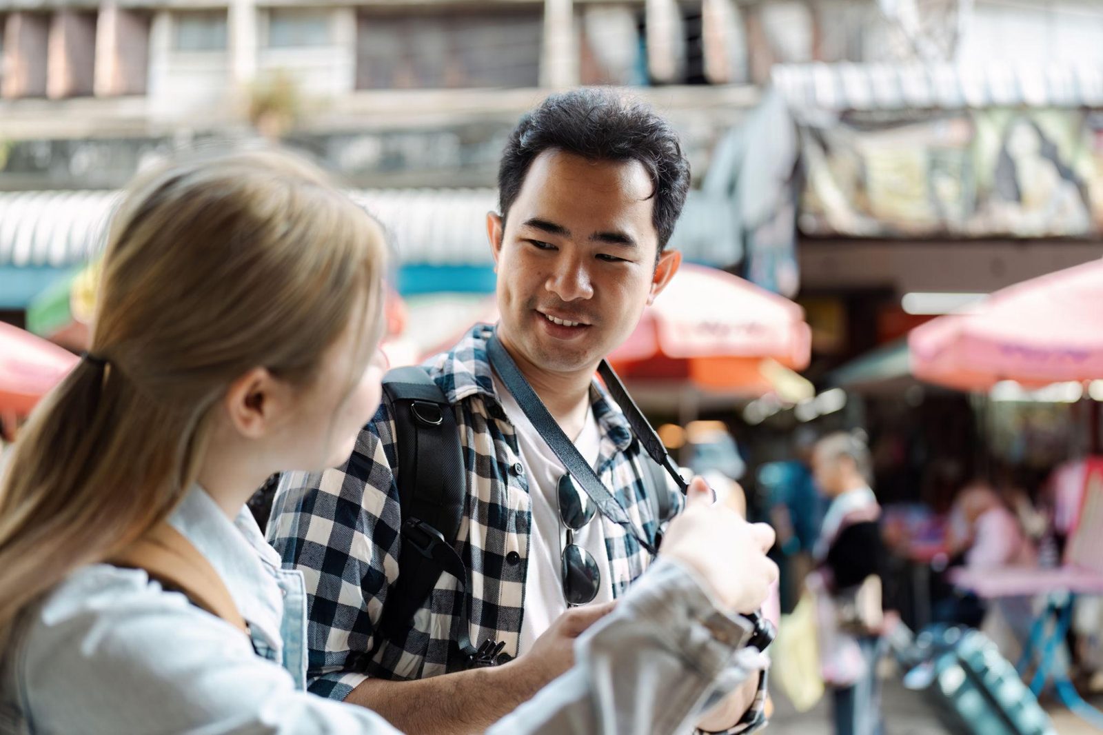 Travelers exploring a Southeast Asian street market